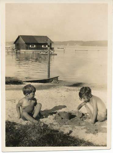 Two kids building a sand castle