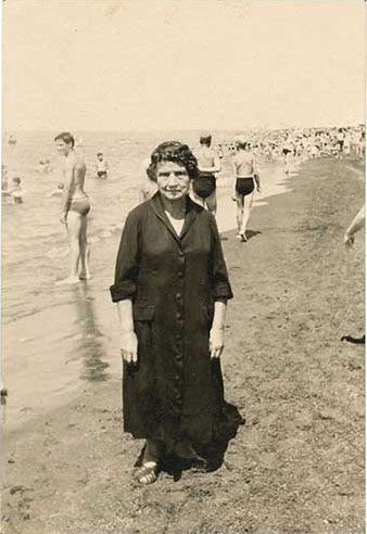 Black dressed woman on the beach